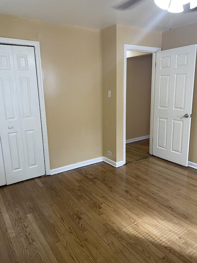 empty room featuring hardwood / wood-style floors and ceiling fan