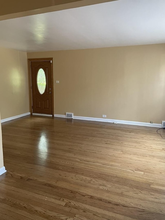 foyer entrance featuring hardwood / wood-style floors