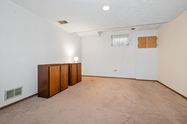 basement with light carpet