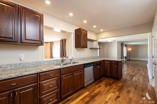 kitchen with dishwasher, sink, dark hardwood / wood-style flooring, baseboard heating, and kitchen peninsula