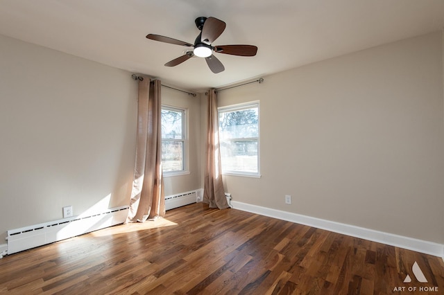 spare room with dark hardwood / wood-style flooring, ceiling fan, and baseboard heating