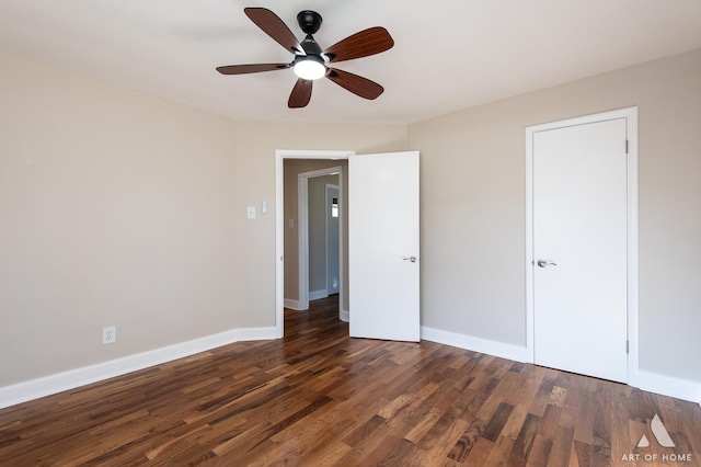 unfurnished bedroom featuring dark wood-type flooring and ceiling fan