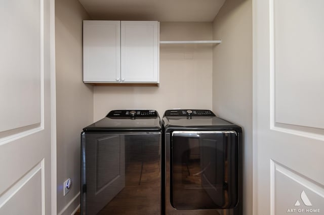 washroom featuring cabinets and independent washer and dryer