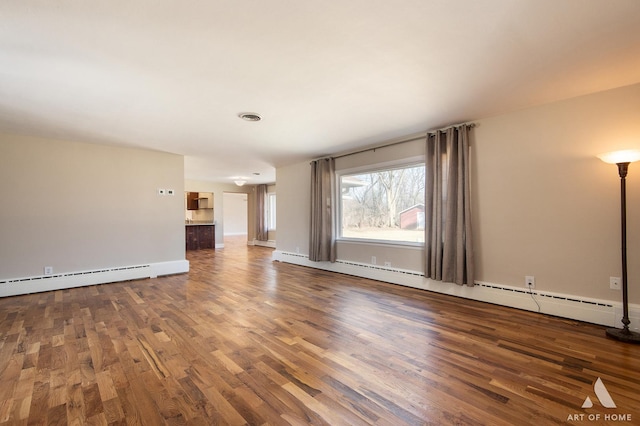 unfurnished living room with wood-type flooring and a baseboard radiator