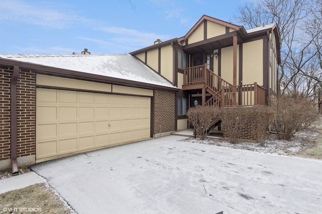 tudor-style house featuring a garage