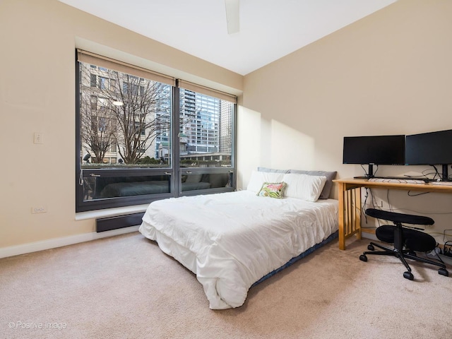 bedroom with ceiling fan and carpet floors