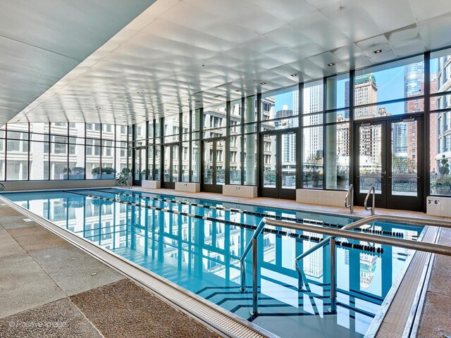 view of pool with french doors