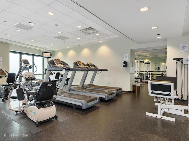 exercise room featuring a drop ceiling