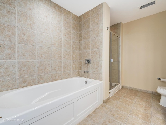 bathroom featuring tile patterned floors, independent shower and bath, and toilet