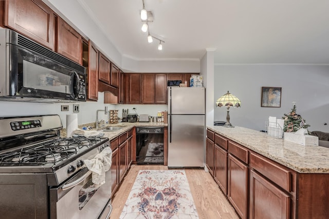 kitchen featuring black appliances, crown molding, sink, light hardwood / wood-style floors, and light stone counters