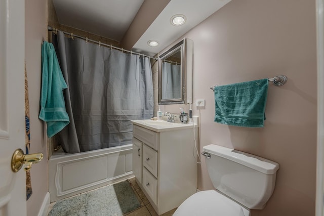 full bathroom featuring tile patterned flooring, shower / bath combo, vanity, and toilet