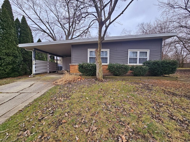 view of front of home featuring a carport