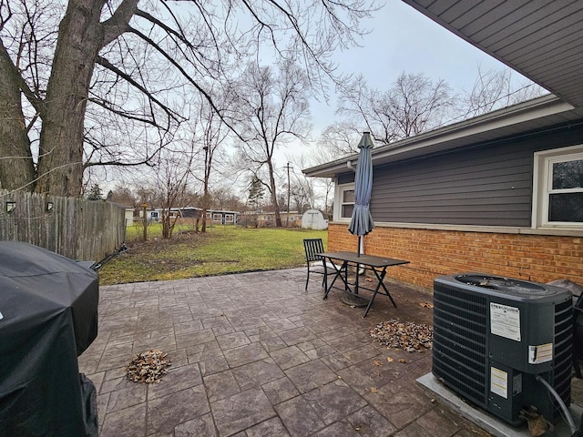 view of patio with area for grilling and central air condition unit