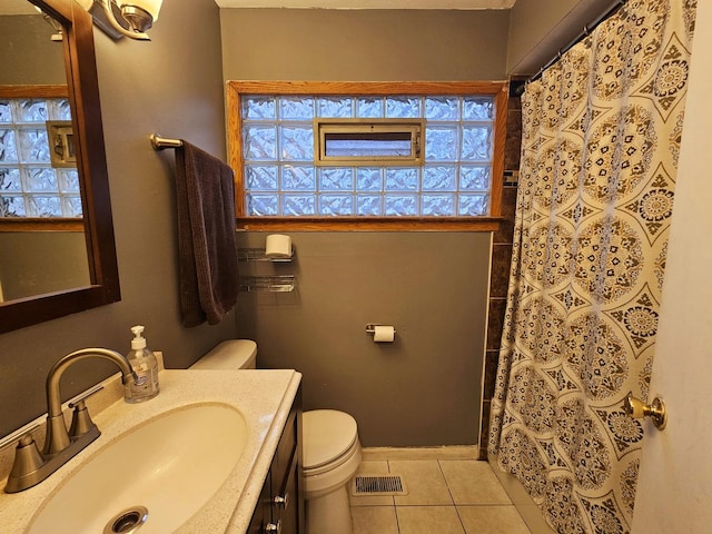 bathroom with tile patterned flooring, vanity, toilet, and a shower with curtain