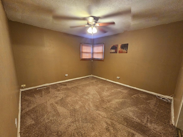 carpeted empty room with a textured ceiling and ceiling fan