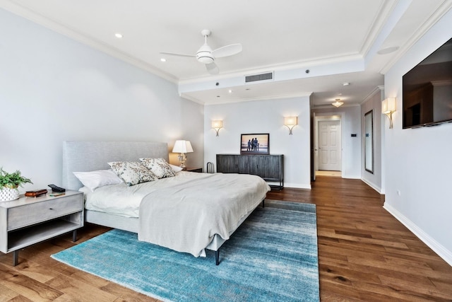 bedroom featuring ceiling fan, dark hardwood / wood-style flooring, and crown molding