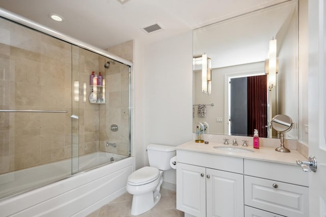 full bathroom with tile patterned floors, vanity, toilet, and combined bath / shower with glass door