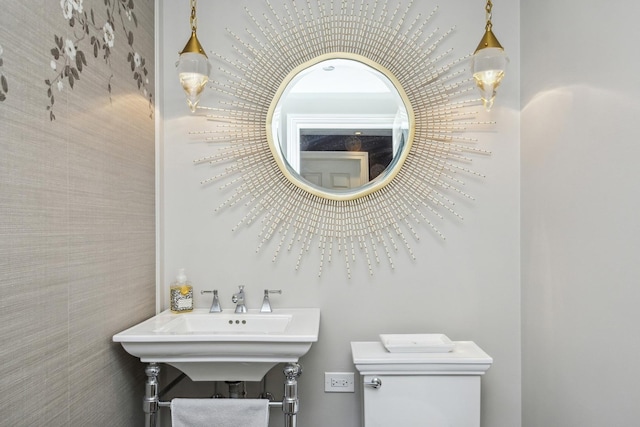 bathroom featuring sink and toilet