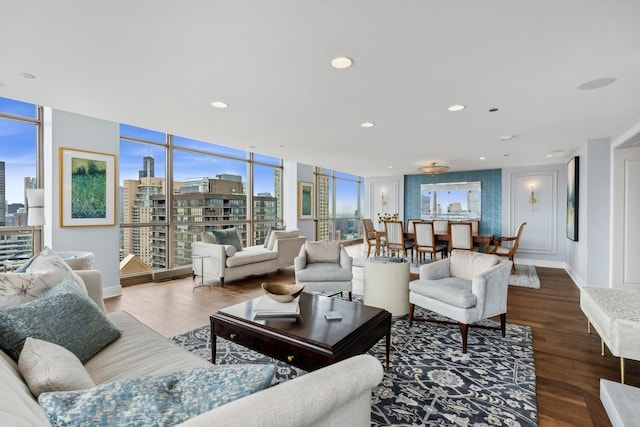 living room with hardwood / wood-style floors and a wall of windows