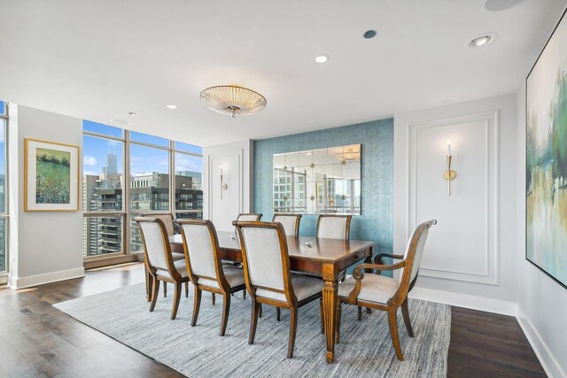 dining area featuring floor to ceiling windows and dark hardwood / wood-style flooring