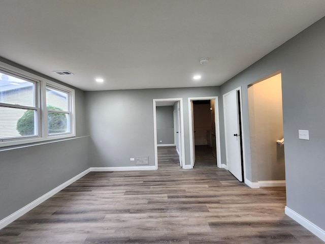 spare room with light wood-type flooring