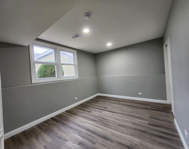 empty room with hardwood / wood-style floors