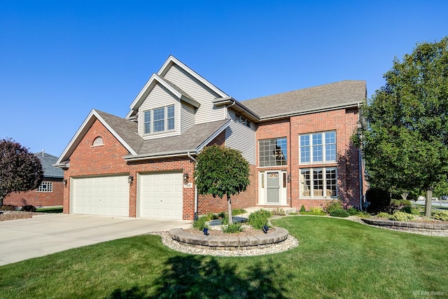 view of front of home with a front yard and a garage