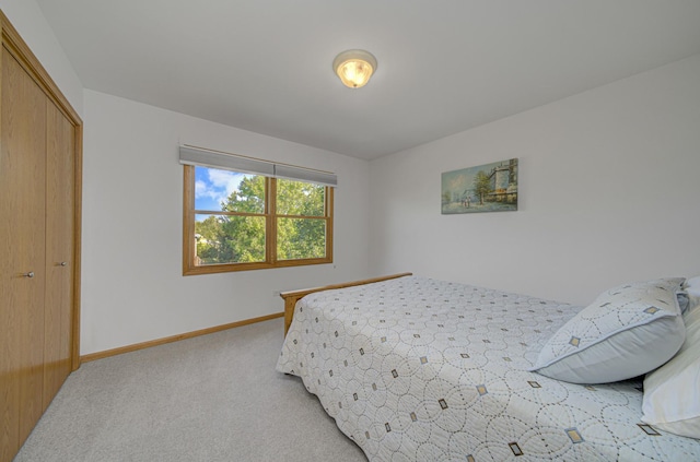 carpeted bedroom with a closet