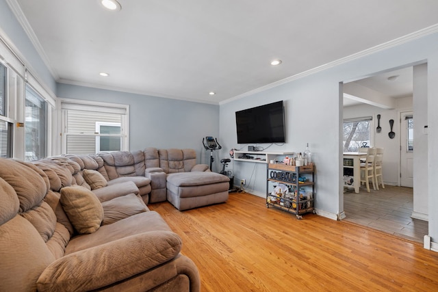 living room with light hardwood / wood-style floors and ornamental molding