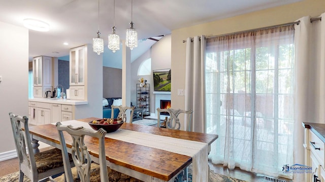 dining room featuring a chandelier, sink, and hardwood / wood-style floors