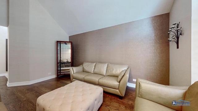 living room featuring vaulted ceiling and dark wood-type flooring