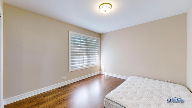 bedroom featuring hardwood / wood-style flooring