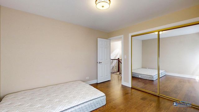 bedroom with a closet and wood-type flooring