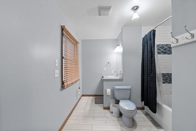 full bathroom with shower / tub combo with curtain, toilet, and sink