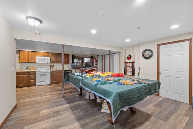 rec room featuring beverage cooler and light hardwood / wood-style floors