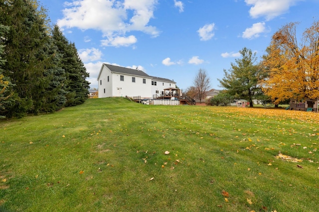 view of yard featuring a wooden deck