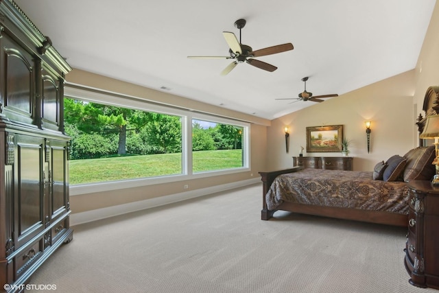 carpeted bedroom featuring vaulted ceiling and ceiling fan