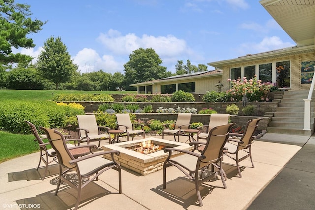 view of patio with a fire pit