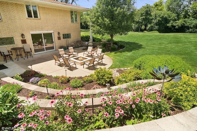 view of yard featuring a patio and an outdoor fire pit