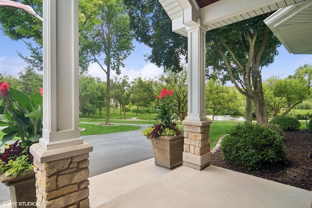 view of patio with a water view