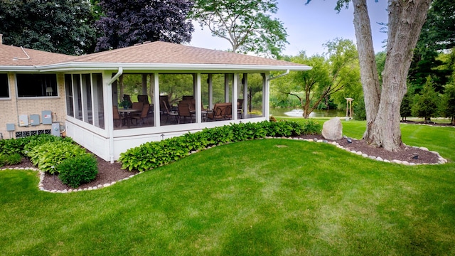 view of yard featuring a sunroom