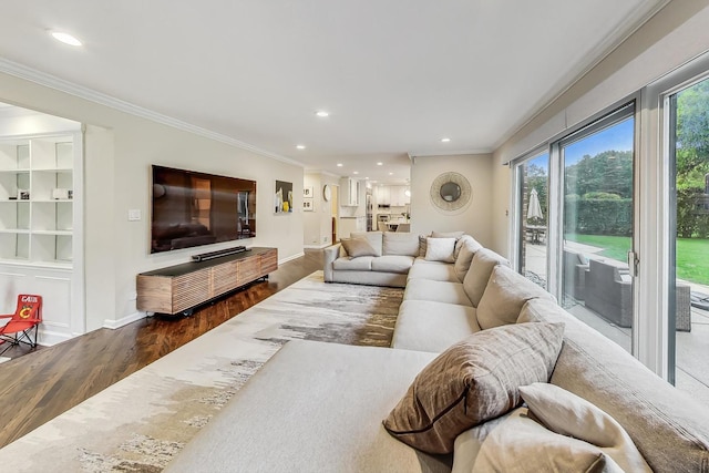 living room featuring wood-type flooring and ornamental molding