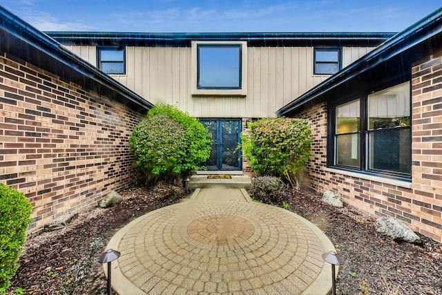 doorway to property with a patio area