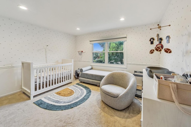 bedroom featuring a nursery area