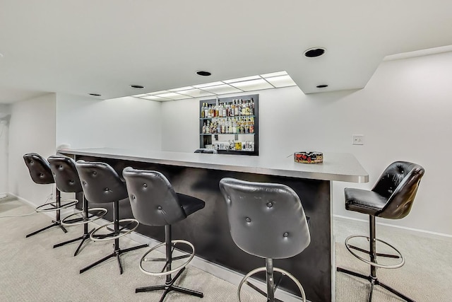 bar featuring light colored carpet