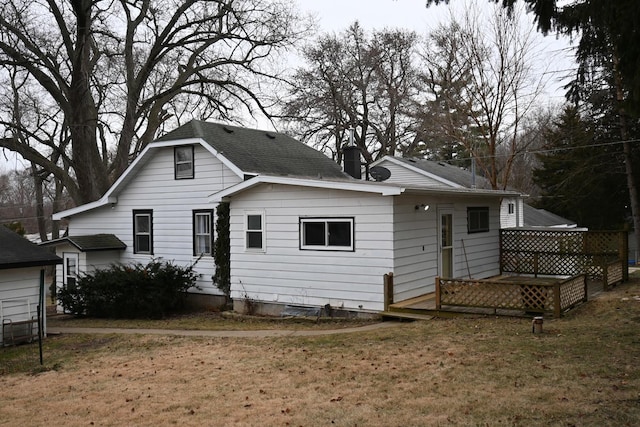 rear view of house with a yard