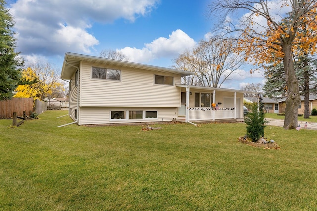 view of front of house with covered porch and a front yard