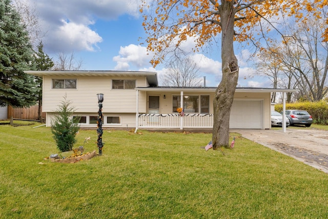 view of front of home featuring covered porch, a front yard, and a garage