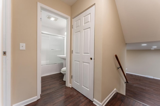 corridor with dark hardwood / wood-style floors