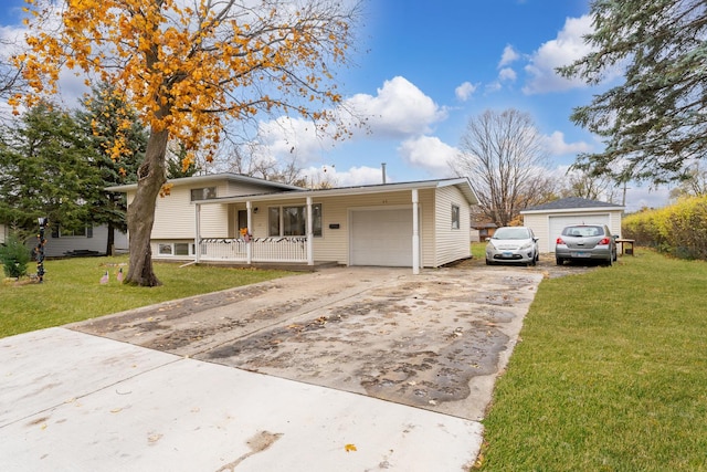 view of front facade featuring covered porch, a garage, and a front lawn